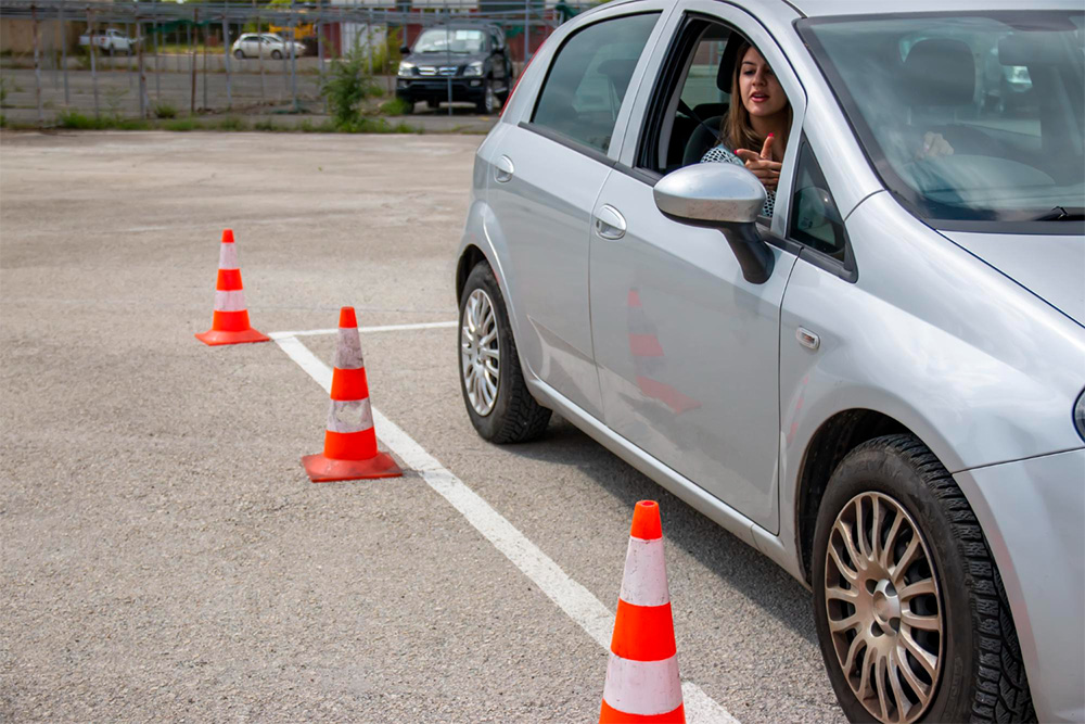 Young driver practicing parking a car
