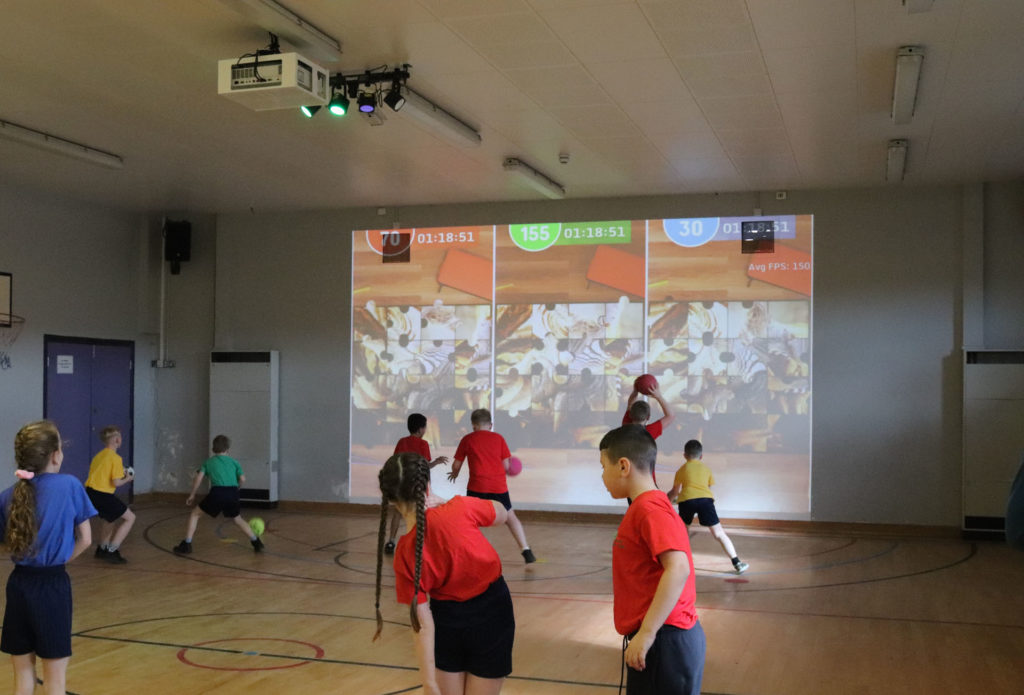 Children interacting with iSports wall